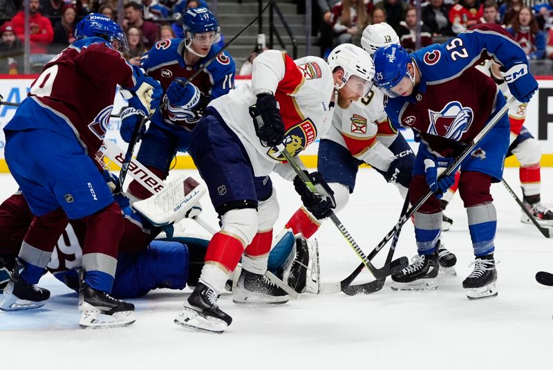 Jan 6, 2025; Denver, Colorado, USA; Florida Panthers center Sam Bennett (9) and Colorado Avalanche right wing Logan O'Connor (25) during  the third period at Ball Arena. Mandatory Credit: Ron Chenoy-Imagn Images