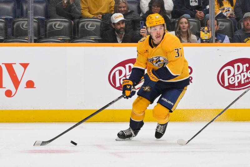 Nov 6, 2025; Nashville, Tennessee, USA;  Nashville Predators defenseman Nick Blankenburg (37) skates with the puck against the Philadelphia Flyers during the second period at Bridgestone Arena. Mandatory Credit: Steve Roberts-Imagn Images