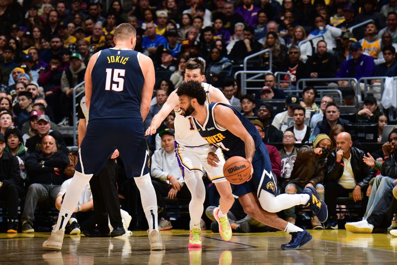 LOS ANGELES, CA - NOVEMBER 23: Jamal Murray #27 of the Denver Nuggets dribbles the ball during the game against the Los Angeles Lakers on November 23, 2024 at Crypto.Com Arena in Los Angeles, California. NOTE TO USER: User expressly acknowledges and agrees that, by downloading and/or using this Photograph, user is consenting to the terms and conditions of the Getty Images License Agreement. Mandatory Copyright Notice: Copyright 2024 NBAE (Photo by Adam Pantozzi/NBAE via Getty Images)