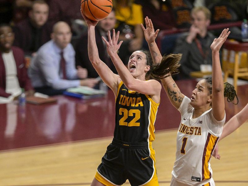 Feb 28, 2024; Minneapolis, Minnesota, USA; Iowa Hawkeyes guard Caitlin Clark (22) attempts a lay-up against the Minnesota Golden Gophers during the first quarter at Williams Arena. Mandatory Credit: Nick Wosika-USA TODAY Sports