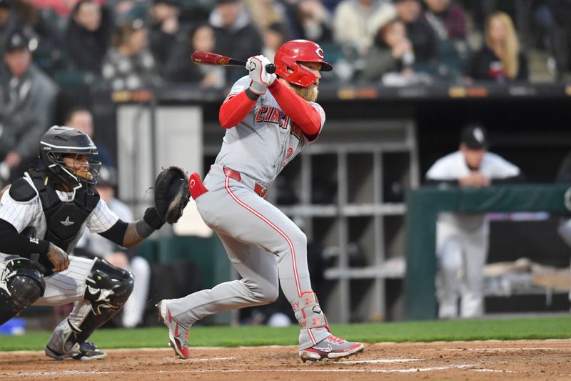 Apr 12, 2024; Chicago, Illinois, USA; Cincinnati Reds left fielder Spencer Steer (7) hits an RBI single during the third inning against the Chicago White Sox at Guaranteed Rate Field. Mandatory Credit: Patrick Gorski-USA TODAY Sports