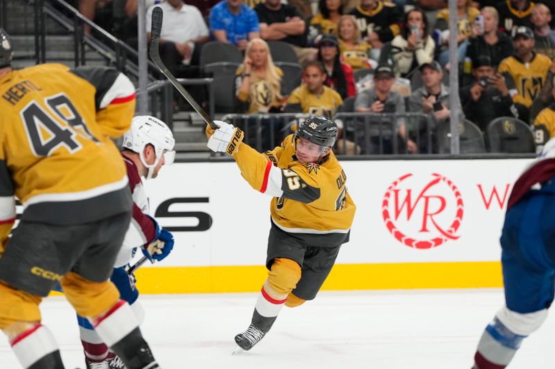 Oct 9, 2024; Las Vegas, Nevada, USA; Vegas Golden Knights right wing Victor Olofsson (95) shoots the puck against the Colorado Avalanche during the second period at T-Mobile Arena. Mandatory Credit: Lucas Peltier-Imagn Images