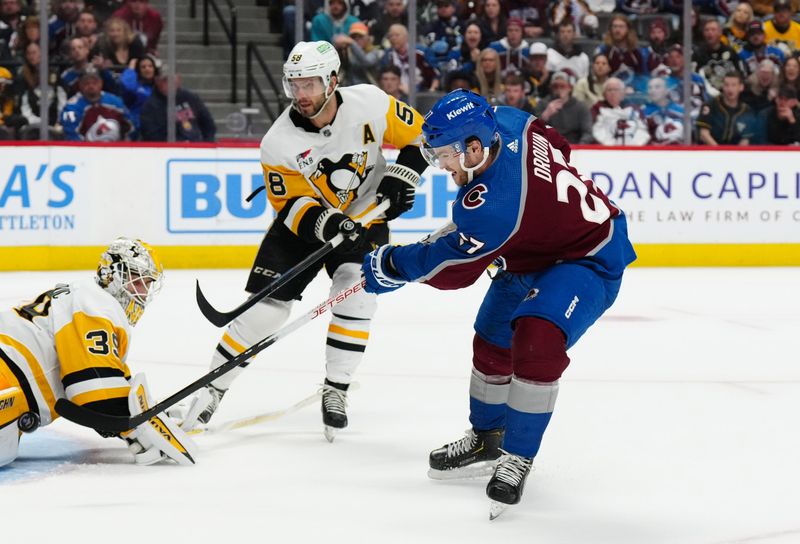 Mar 24, 2024; Denver, Colorado, USA; Colorado Avalanche left wing Jonathan Drouin (27) shoots and scores an overtime goal on Pittsburgh Penguins goaltender Alex Nedeljkovic (39) and defenseman Kris Letang (58) at Ball Arena. Mandatory Credit: Ron Chenoy-USA TODAY Sports