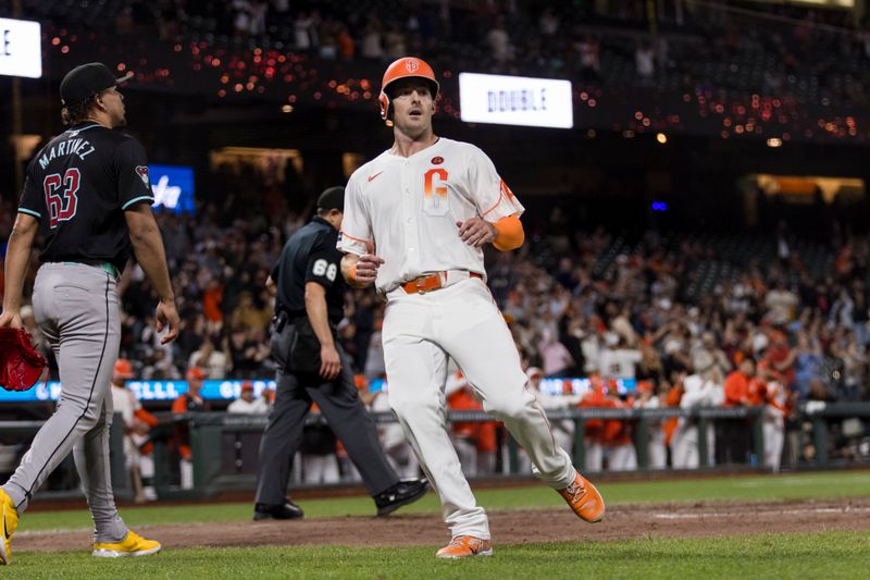 Sep 3, 2024; San Francisco, California, USA;   San Francisco Giants right fielder Mike Yastrzemski (5) scores against the Arizona Diamondbacks during the ninth inning at Oracle Park. Mandatory Credit: John Hefti-Imagn Images