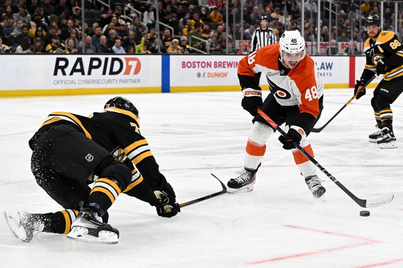 Oct 1, 2024; Boston, Massachusetts, USA; Boston Bruins defenseman Charlie McAvoy (73) defends Philadelphia Flyers center Morgan Frost (48) during the second period at the TD Garden. Mandatory Credit: Brian Fluharty-Imagn Images