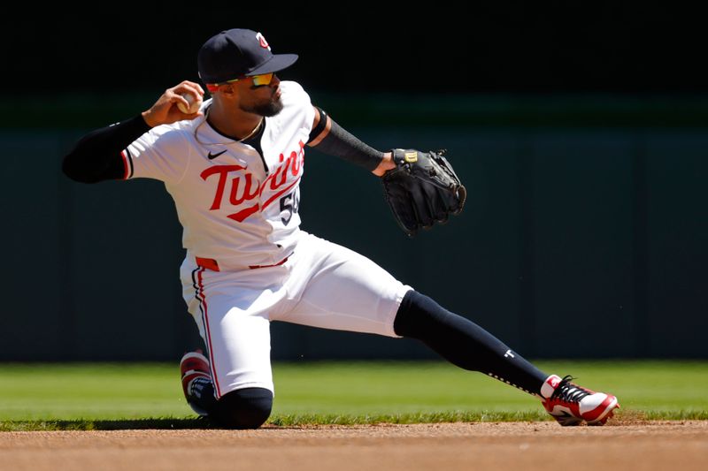 Apr 21, 2024; Minneapolis, Minnesota, USA; Minnesota Twins shortstop Willi Castro (50) fields the ball for a fielder's choice on the at-bat of Detroit Tigers first baseman Spencer Torkelson (not pictured) in the first inning at Target Field. Mandatory Credit: Bruce Kluckhohn-USA TODAY Sports