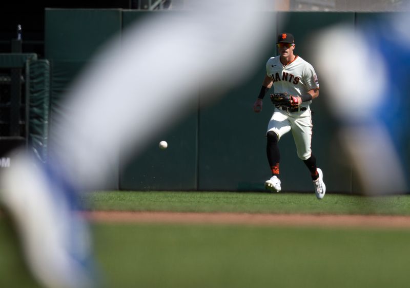 Oct 1, 2023; San Francisco, California, USA; San Francisco Giants center fielder Tyler Fitzgerald plays an RBI single by Los Angeles Dodgers center fielder James Outman on a hop during the sixth inning at Oracle Park. Mandatory Credit: D. Ross Cameron-USA TODAY Sports