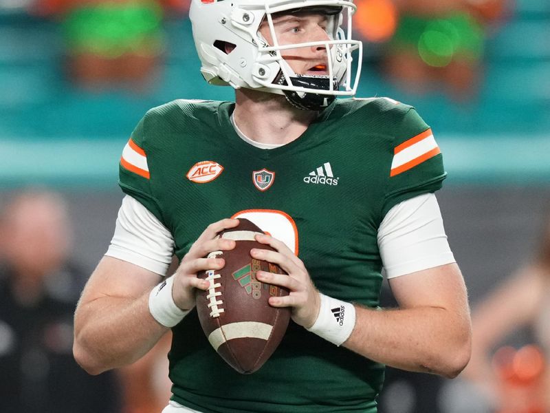 Nov 20, 2021; Miami Gardens, Florida, USA; Miami Hurricanes quarterback Tyler Van Dyke (9) drops back before attempting a pass against the Virginia Tech Hokies during the first half at Hard Rock Stadium. Mandatory Credit: Jasen Vinlove-USA TODAY Sports