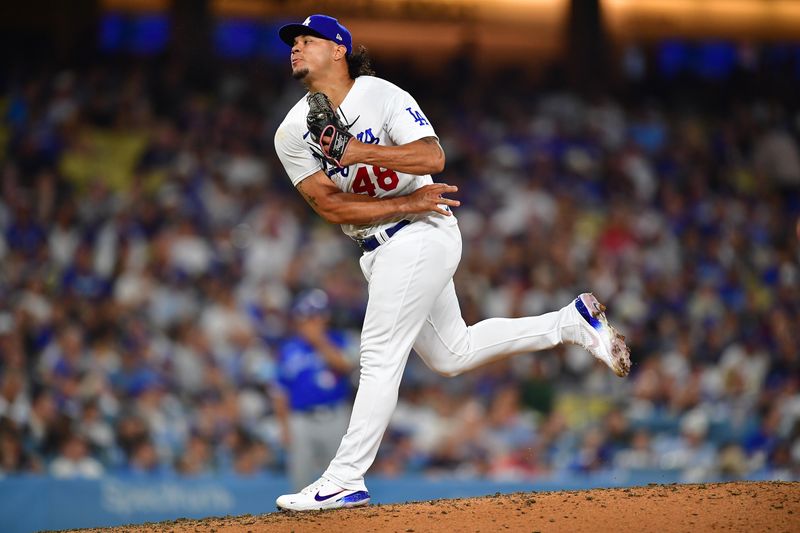 Jul 24, 2023; Los Angeles, California, USA; Los Angeles Dodgers relief pitcher Brusdar Graterol (48) throws against the Toronto Blue Jays during the eighth inning at Dodger Stadium. Mandatory Credit: Gary A. Vasquez-USA TODAY Sports