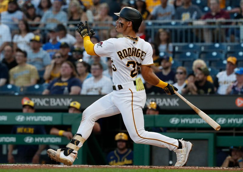 Sep 4, 2023; Pittsburgh, Pennsylvania, USA;  Pittsburgh Pirates catcher Endy Rodriguez (25) hits a double against the Milwaukee Brewers during the second inning at PNC Park. Mandatory Credit: Charles LeClaire-USA TODAY Sports