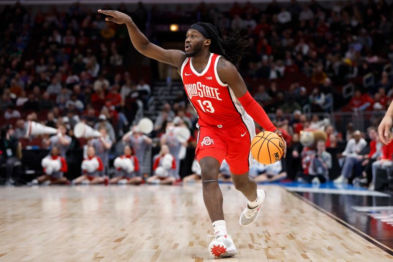 Mar 11, 2023; Chicago, IL, USA; Ohio State Buckeyes guard Isaac Likekele (13) brings the ball up court against the Purdue Boilermakers during the first half at United Center. Mandatory Credit: Kamil Krzaczynski-USA TODAY Sports