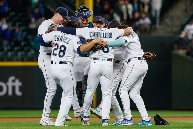 Jun 13, 2023; Seattle, Washington, USA; Seattle Mariners relief pitcher Tayler Saucedo (60, left) and catcher Cal Raleigh (29, third from left) do a celebratory dance with teammates following a 9-3 victory against the Miami Marlins at T-Mobile Park. Mandatory Credit: Joe Nicholson-USA TODAY Sports