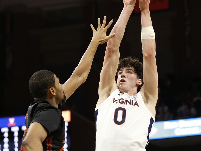 Feb 5, 2024; Charlottesville, Virginia, USA; Virginia Cavaliers forward Blake Buchanan (0) shoots the ball over Miami (Fl) Hurricanes forward AJ Casey (23) during the second half at John Paul Jones Arena. Mandatory Credit: Amber Searls-USA TODAY Sports