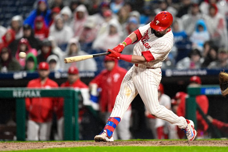 May 4, 2024; Philadelphia, Pennsylvania, USA; Philadelphia Phillies designated hitter Kyle Schwarber (12) hits a single against the San Francisco Giants during the fifth inning at Citizens Bank Park. Mandatory Credit: John Jones-USA TODAY Sports