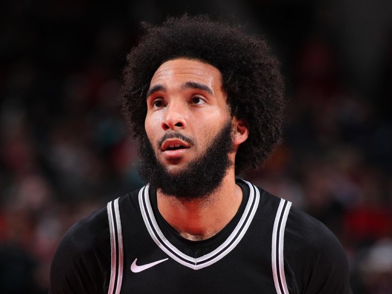 PORTLAND, OR - DECEMBER 13: Julian Champagnie #30 of the San Antonio Spurs looks on during the game against the Portland Trail Blazers on December 13, 2024 at the Moda Center Arena in Portland, Oregon. NOTE TO USER: User expressly acknowledges and agrees that, by downloading and or using this photograph, user is consenting to the terms and conditions of the Getty Images License Agreement. Mandatory Copyright Notice: Copyright 2024 NBAE (Photo by Cameron Browne/NBAE via Getty Images)