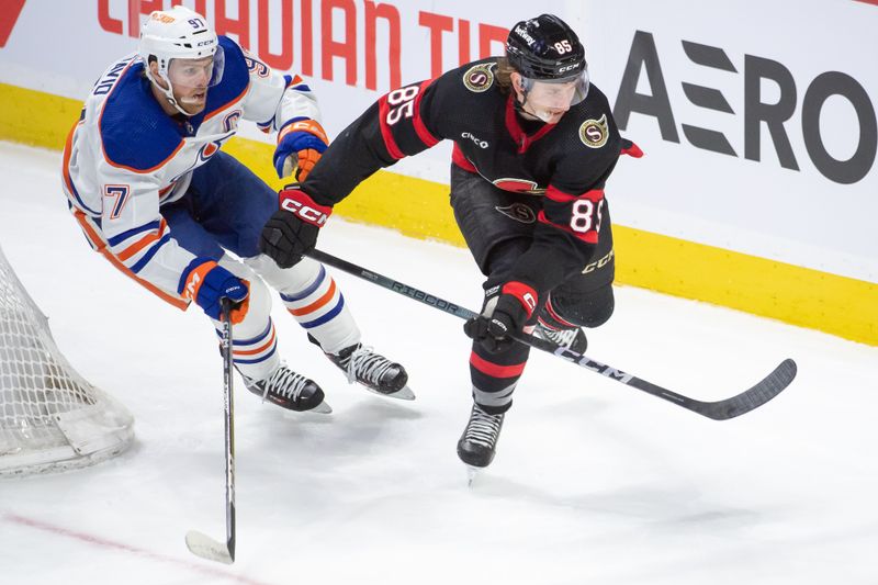 Mar 24, 2024; Ottawa, Ontario, CAN; Edmonton Oilers center Connor McDavid (97) chases  Ottawa Senators defenseman Jake Sanderson (85) in the third period at the Canadian Tire Centre. Mandatory Credit: Marc DesRosiers-USA TODAY Sports