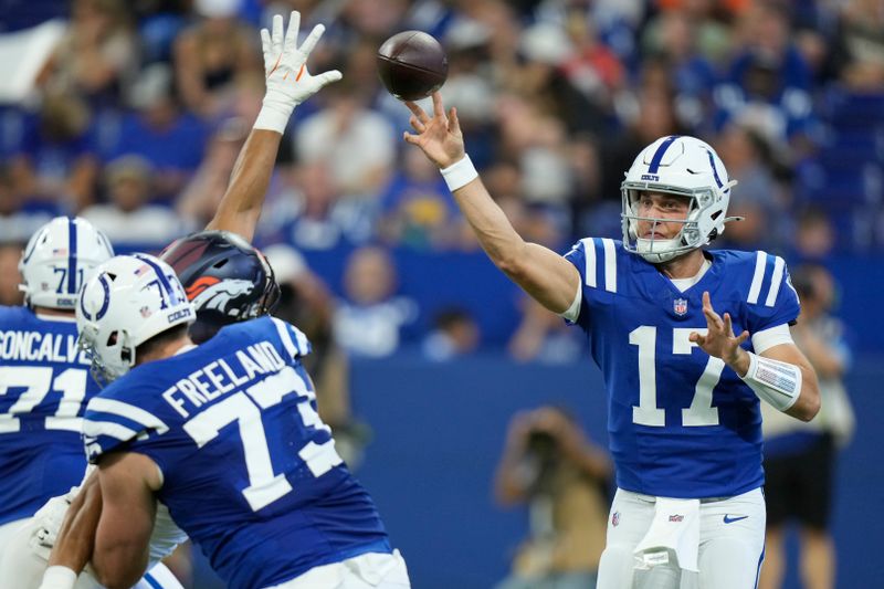 Indianapolis Colts quarterback Kedon Slovis (17) passes against the Denver Broncos during the third quarter of a preseason NFL football game, Sunday, Aug. 11, 2024, in Westfield, Ind. (AP Photo/AJ Mast)