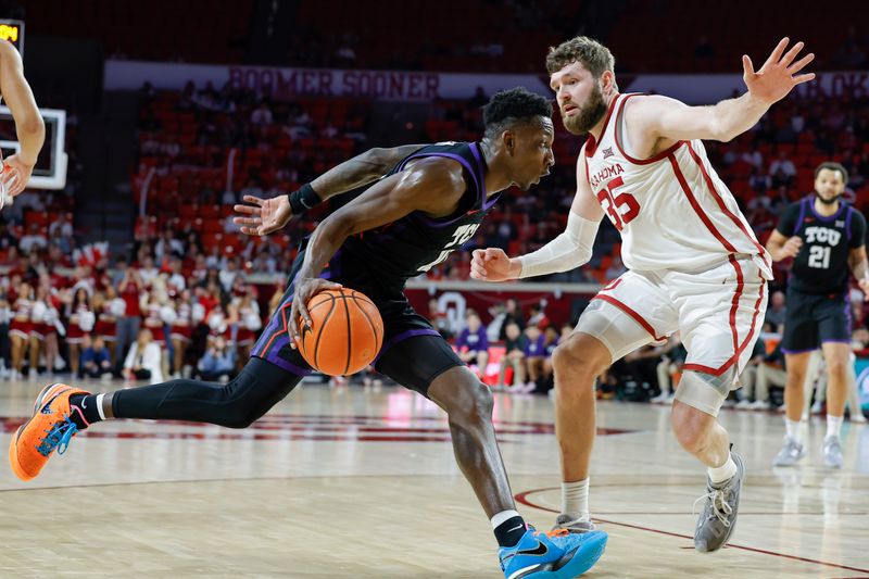 Mar 4, 2023; Norman, Oklahoma, USA; TCU Horned Frogs guard Damion Baugh (10) drives to the basket against Oklahoma Sooners forward Tanner Groves (35) during the first half at Lloyd Noble Center. Mandatory Credit: Alonzo Adams-USA TODAY Sports