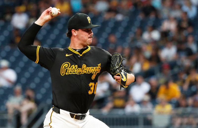 Jun 17, 2024; Pittsburgh, Pennsylvania, USA;  Pittsburgh Pirates starting pitcher Paul Skenes (30) delivers a pitch against the Cincinnati Reds during the first inning at PNC Park. Mandatory Credit: Charles LeClaire-USA TODAY Sports