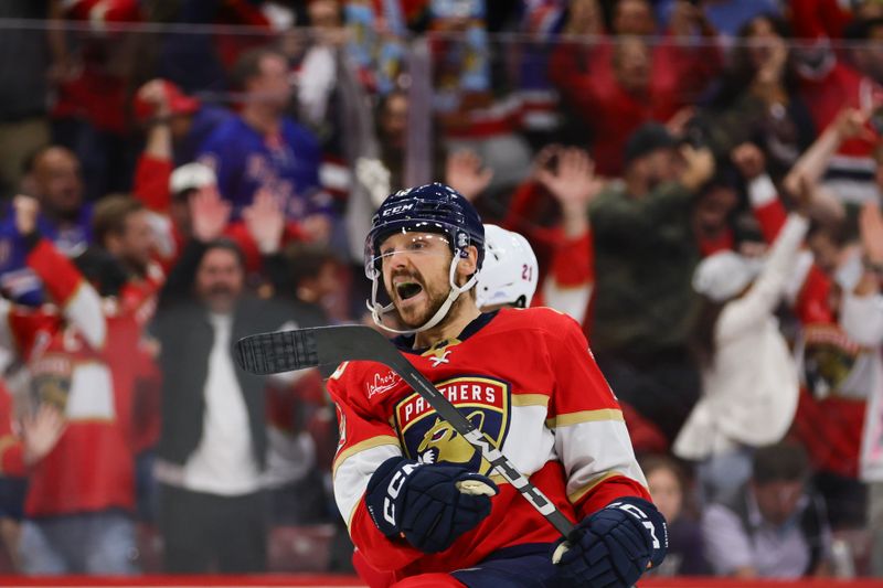 May 28, 2024; Sunrise, Florida, USA; Florida Panthers center Sam Reinhart (13) celebrates after scoring the game-winning goal during overtime against the New York Rangers in game four of the Eastern Conference Final of the 2024 Stanley Cup Playoffs at Amerant Bank Arena. Mandatory Credit: Sam Navarro-USA TODAY Sports