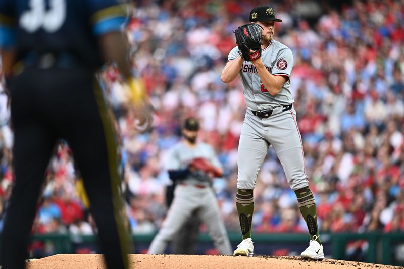 May 17, 2024; Philadelphia, Pennsylvania, USA; Washington Nationals starting pitcher Jake Irvin (27) stand on the mound with runners on base against the Philadelphia Phillies in the second inning at Citizens Bank Park. Mandatory Credit: Kyle Ross-USA TODAY Sports