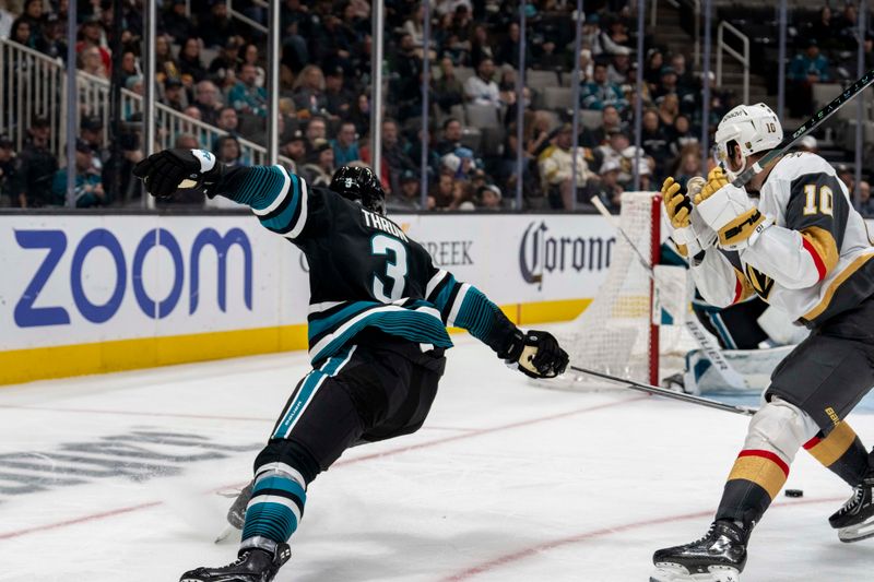 Feb 19, 2024; San Jose, California, USA; Vegas Golden Knights center Nicolas Roy (10) has the puck stolen by San Jose Sharks defenseman Henry Thrun (3) during the third period at SAP Center at San Jose. Mandatory Credit: Neville E. Guard-USA TODAY Sports