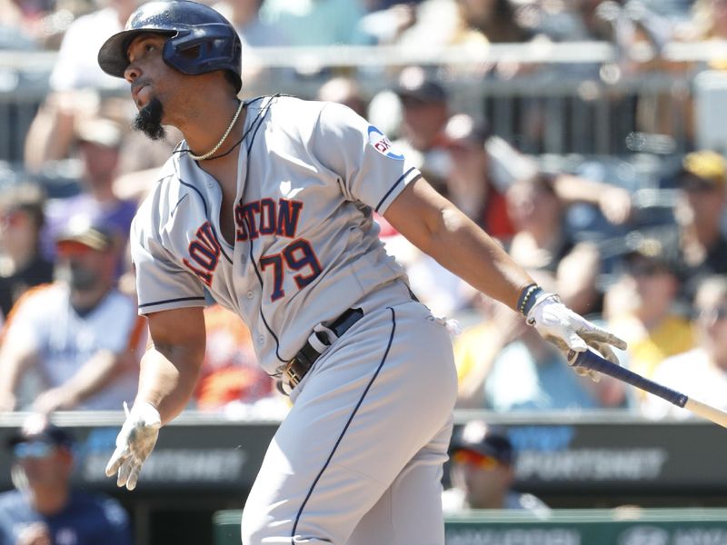 Apr 12, 2023; Pittsburgh, Pennsylvania, USA;  Houston Astros first baseman Jose Abreu (79) hits an RBI single against the Houston Astros during the third inning at PNC Park. Mandatory Credit: Charles LeClaire-USA TODAY Sports