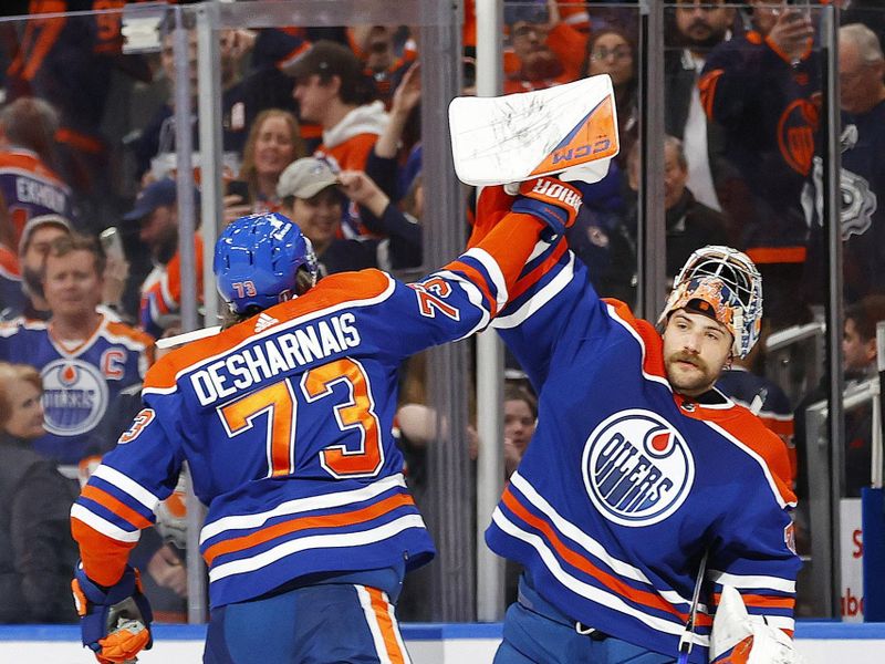 May 1, 2024; Edmonton, Alberta, CAN;Edmonton Oilers goaltender Stuart Skinner (74) and defensemen Vincent Desharnais (73) celebrate a victory against the Los Angeles Kings in game five of the first round of the 2024 Stanley Cup Playoffs at Rogers Place. Mandatory Credit: Perry Nelson-USA TODAY Sports