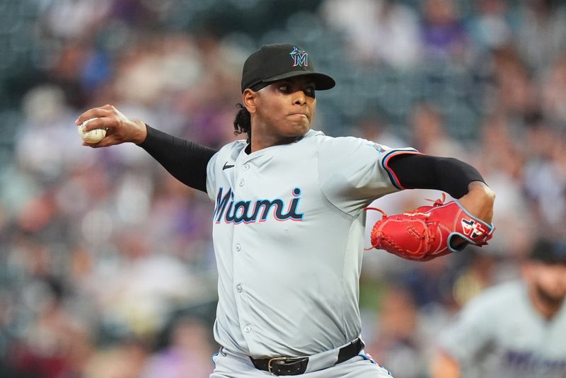 Aug 26, 2024; Denver, Colorado, USA; Miami Marlins starting pitcher Edward Cabrera (27) delivers a pitch in the fifth inning against the Colorado Rockies at Coors Field. Mandatory Credit: Ron Chenoy-USA TODAY Sports