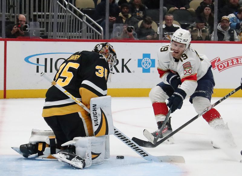 Dec 3, 2024; Pittsburgh, Pennsylvania, USA;  Pittsburgh Penguins goaltender Tristan Jarry (35) makes a save against Florida Panthers left wing Matthew Tkachuk (19) second period at PPG Paints Arena. Mandatory Credit: Charles LeClaire-Imagn Images