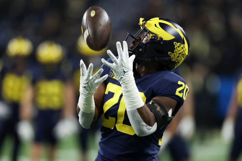 Dec 3, 2022; Indianapolis, Indiana, USA; Michigan Wolverines quarterback Andy Maddox (20) warms up before the Big Ten Championship against the Purdue Boilermakers at Lucas Oil Stadium. Mandatory Credit: Trevor Ruszkowski-USA TODAY Sports