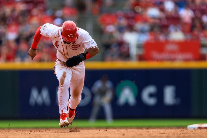 Aug 4, 2024; Cincinnati, Ohio, USA; Cincinnati Reds outfielder Santiago Espinal (4) steals third in the fifth inning against the San Francisco Giants at Great American Ball Park. Mandatory Credit: Katie Stratman-USA TODAY Sports