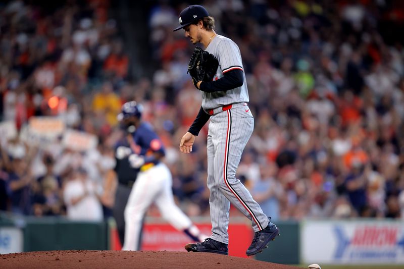 Jun 1, 2024; Houston, Texas, USA; Minnesota Twins starting pitcher Joe Ryan (41) reacts after giving up a two-run home run to Houston Astros designated hitter Yordan Alvarez (44) during the first inning at Minute Maid Park. Mandatory Credit: Erik Williams-USA TODAY Sports