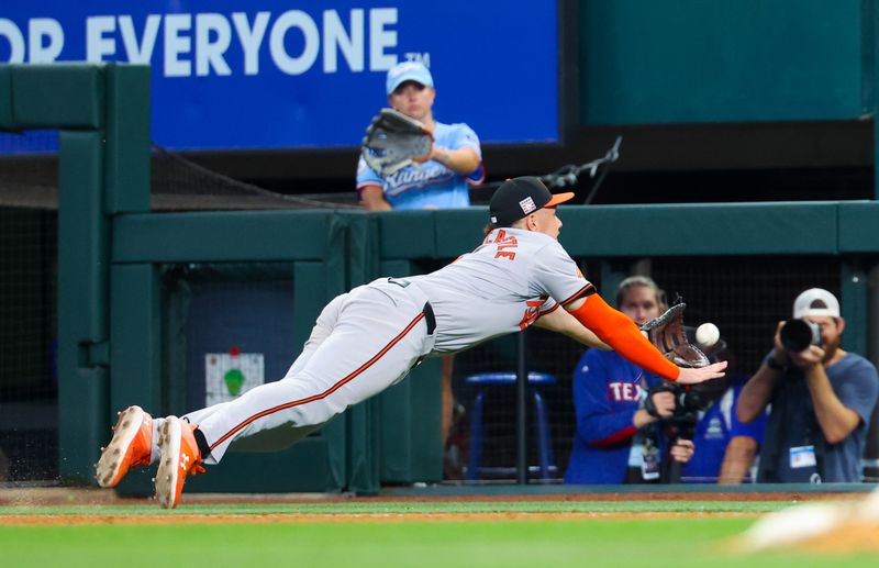 Jul 21, 2024; Arlington, Texas, USA;  Baltimore Orioles first baseman Ryan Mountcastle (6) makes a diving catch during the seventh inning against the Texas Rangers at Globe Life Field. Mandatory Credit: Kevin Jairaj-USA TODAY Sports