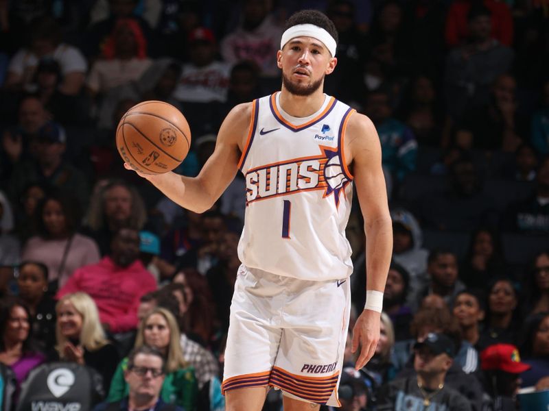 CHARLOTTE, NC - MARCH 15:  Devin Booker #1 of the Phoenix Suns handles the ball during the game on March 15, 2024 at Spectrum Center in Charlotte, North Carolina. NOTE TO USER: User expressly acknowledges and agrees that, by downloading and or using this photograph, User is consenting to the terms and conditions of the Getty Images License Agreement.  Mandatory Copyright Notice:  Copyright 2024 NBAE (Photo by Kent Smith/NBAE via Getty Images)