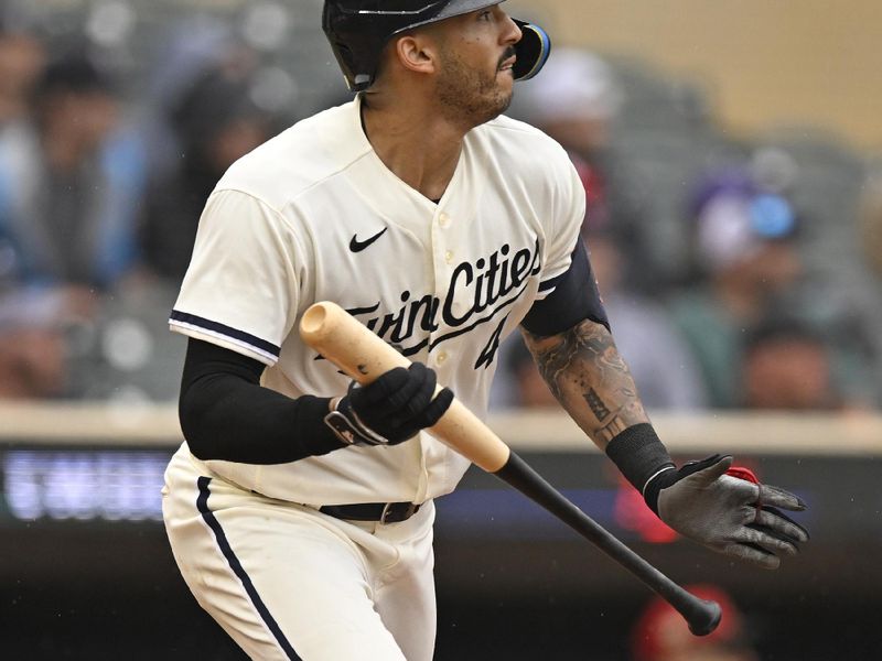 Aug 6, 2023; Minneapolis, Minnesota, USA;  Minnesota Twins infielder Carlos Correa (4) collects his 600th and 601st career RBI on a single against the Arizona Diamondbacks during the sixth inning at Target Field. Mandatory Credit: Nick Wosika-USA TODAY Sports