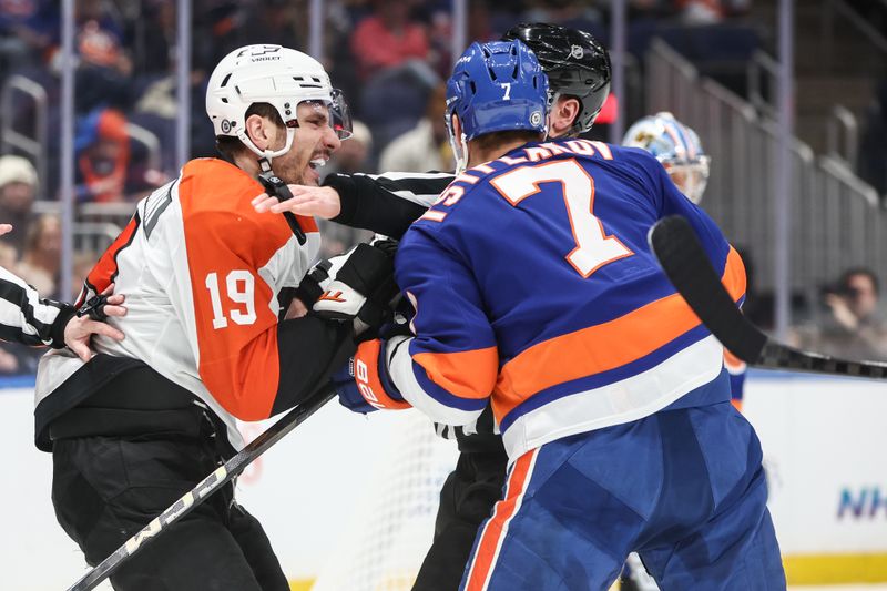 Jan 16, 2025; Elmont, New York, USA;  An official attempts to separate Philadelphia Flyers right wing Garnet Hathaway (19) and New York Islanders right wing Maxim Tsyplakov (7) in the first period at UBS Arena. Mandatory Credit: Wendell Cruz-Imagn Images