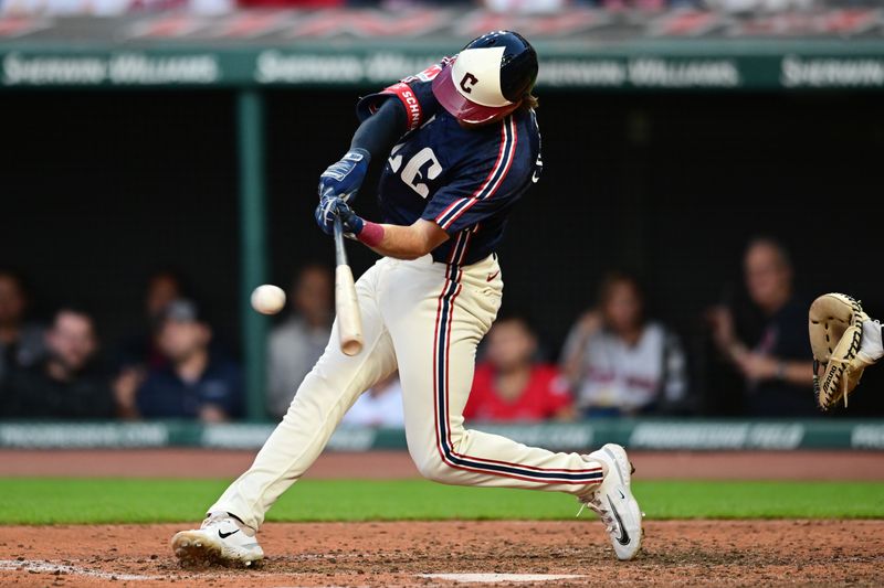 Jul 19, 2024; Cleveland, Ohio, USA; Cleveland Guardians shortstop Daniel Schneemann (10) hits an RBI double during the fifth inning against the San Diego Padres at Progressive Field. Mandatory Credit: Ken Blaze-USA TODAY Sports