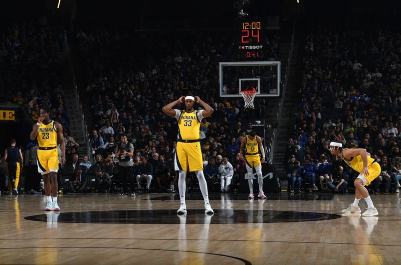 SAN FRANCISCO, CA - MARCH 22: Myles Turner #33, Aaron Nesmith #23 and Andrew Nembhard #2 of the Indiana Pacers looks on during the game against the Golden State Warriors on March 22, 2024 at Chase Center in San Francisco, California. NOTE TO USER: User expressly acknowledges and agrees that, by downloading and or using this photograph, user is consenting to the terms and conditions of Getty Images License Agreement. Mandatory Copyright Notice: Copyright 2024 NBAE (Photo by Noah Graham/NBAE via Getty Images)