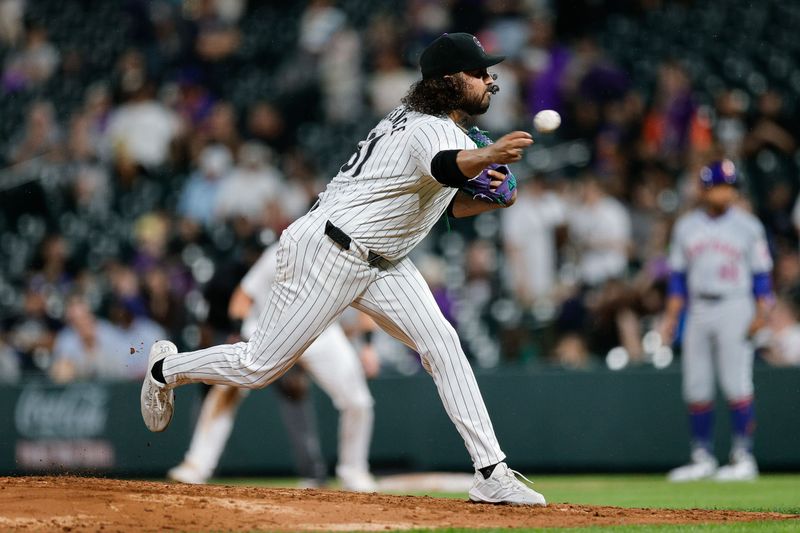 Aug 6, 2024; Denver, Colorado, USA; Colorado Rockies relief pitcher Justin Lawrence (61) pitches in the sixth inning against the New York Mets at Coors Field. Mandatory Credit: Isaiah J. Downing-USA TODAY Sports