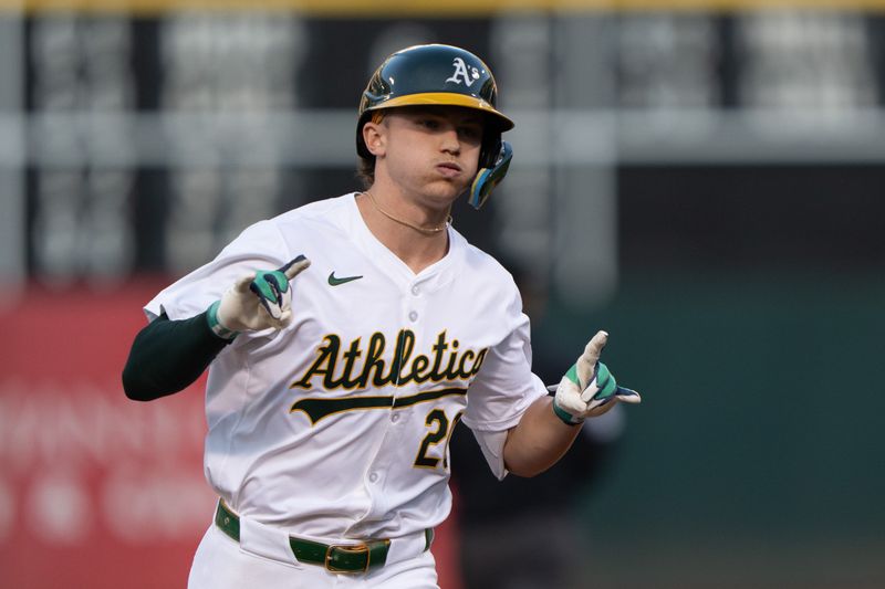 Jul 23, 2024; Oakland, California, USA;  Oakland Athletics second base Zack Gelof (20) reacts to the dugout after hitting a solo home run during the fourth inning against the Houston Astros at Oakland-Alameda County Coliseum. Mandatory Credit: Stan Szeto-USA TODAY Sports