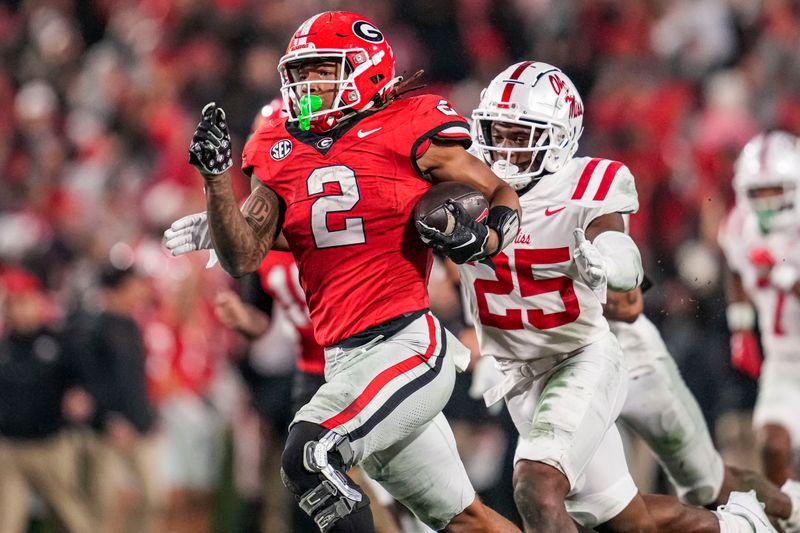 Nov 11, 2023; Athens, Georgia, USA; A Georgia Bulldogs running back Kendall Milton (2) breaks a long run against the Mississippi Rebels during the second half at Sanford Stadium. Mandatory Credit: Dale Zanine-USA TODAY Sports