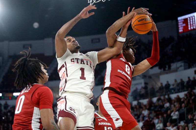 Feb 17, 2024; Starkville, Mississippi, USA; Mississippi State Bulldogs forward Tolu Smith (1) and Arkansas Razorbacks forward Chandler Lawson (8) battle for a rebound during the first half at Humphrey Coliseum. Mandatory Credit: Petre Thomas-USA TODAY Sports