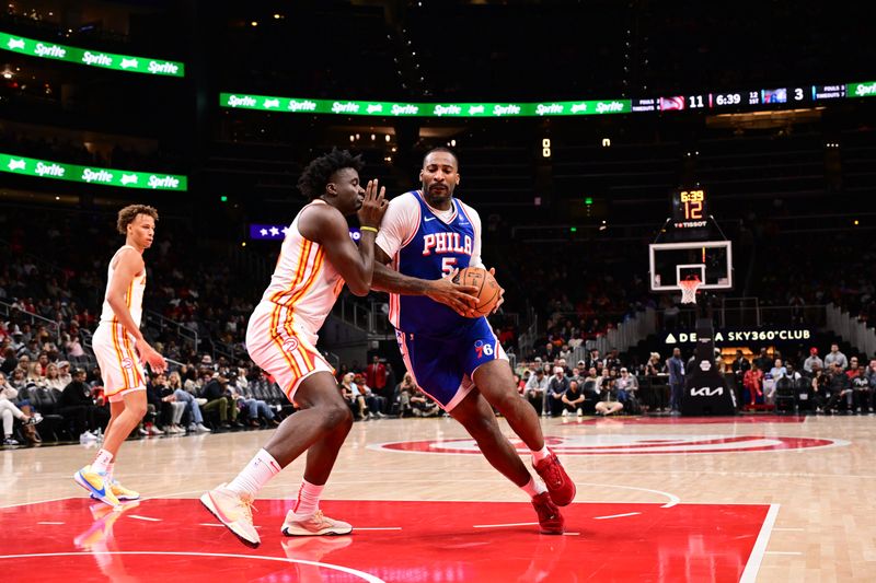 ATLANTA, GA - OCTOBER 14: Andre Drummond #5 of the Philadelphia 76ers drives to the basket during the game against the Atlanta Hawks during a preseason game on October 14, 2024 at State Farm Arena in Atlanta, Georgia.  NOTE TO USER: User expressly acknowledges and agrees that, by downloading and/or using this Photograph, user is consenting to the terms and conditions of the Getty Images License Agreement. Mandatory Copyright Notice: Copyright 2024 NBAE (Photo by Adam Hagy/NBAE via Getty Images)