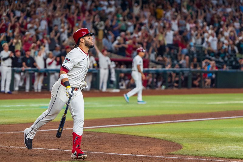 Sep 15, 2024; Phoenix, Arizona, USA; Arizona Diamondbacks infielder Eugenio Suárez (28) reacts after hitting a sharp fly ball to right field to score the winning runs in the tenth inning against the Milwaukee Brewers at Chase Field. Mandatory Credit: Allan Henry-Imagn Images