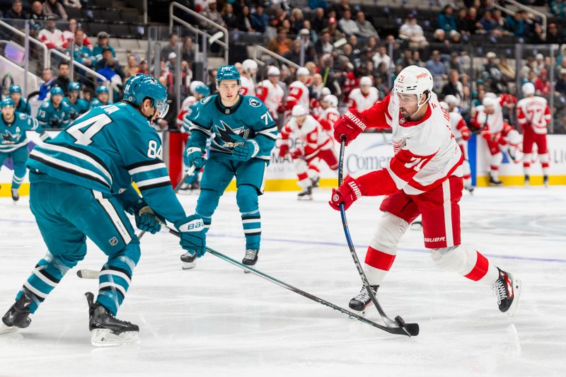 Nov 18, 2024; San Jose, California, USA; Detroit Red Wings center Dylan Larkin (71) shoots during the first period against the San Jose Sharks at SAP Center at San Jose. Mandatory Credit: Bob Kupbens-Imagn Images