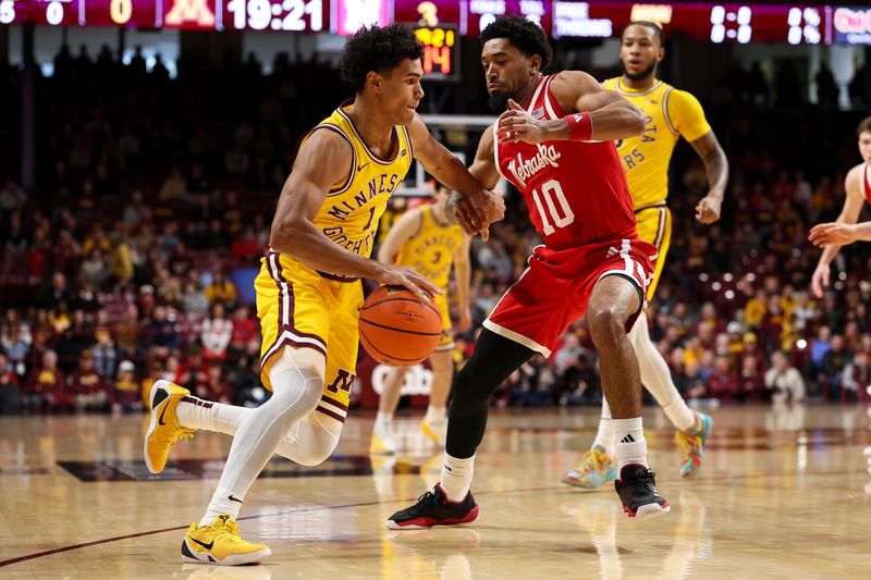 Jan 24, 2026; Minneapolis, Minnesota, USA; Minnesota Golden Gophers guard Isaac Asuma (1) works around Nebraska Cornhuskers guard Jamarques Lawrence (10) during the first half at Williams Arena. Mandatory Credit: Matt Krohn-Imagn Images