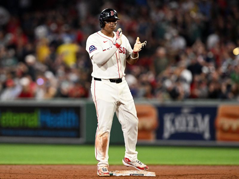 May 17, 2025; Boston, Massachusetts, USA; Boston Red Sox designated hitter Rafael Devers (11) reacts after hitting a RBI against the Atlanta Braves during the seventh inning at Fenway Park. Mandatory Credit: Brian Fluharty-Imagn Images