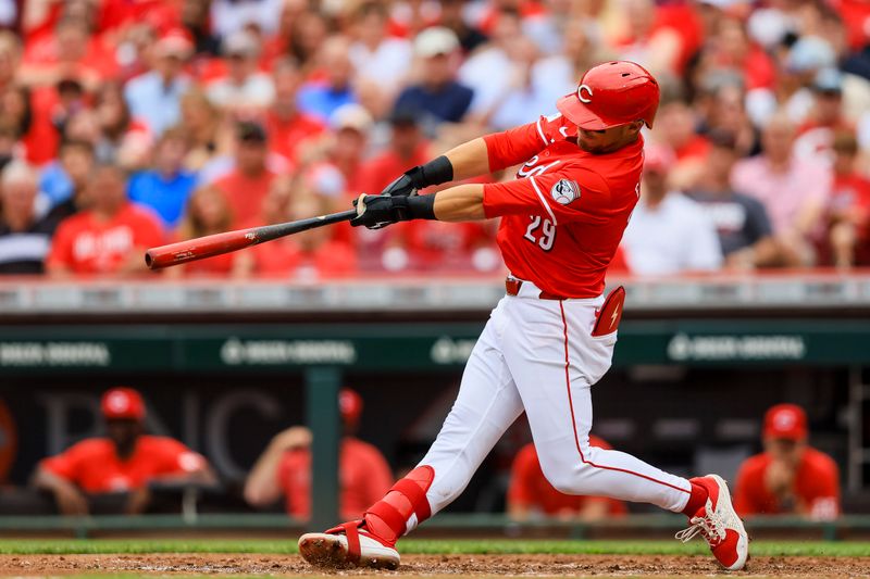 Jun 8, 2024; Cincinnati, Ohio, USA; Cincinnati Reds outfielder TJ Friedl (29) hits a two-run home run in the third inning against the Chicago Cubs at Great American Ball Park. Mandatory Credit: Katie Stratman-USA TODAY Sports