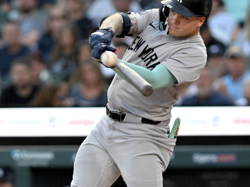 Aug 16, 2024; Detroit, Michigan, USA;  New York Yankees left fielder Alex Verdugo (24) hits a sacrifice fly to drive in a run against the Detroit Tigers in the first inning at Comerica Park. Mandatory Credit: Lon Horwedel-USA TODAY Sports